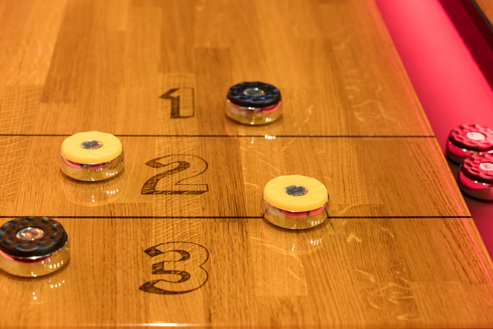 Underground Entertainment Center using Shuffly shuffleboard