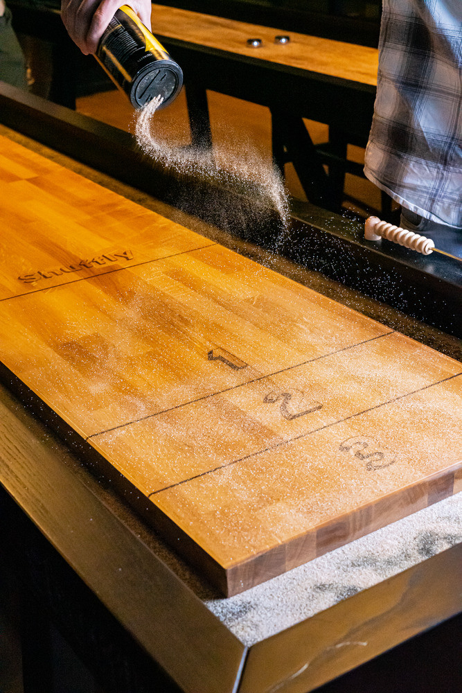 Low maintenance shuffleboards with sand