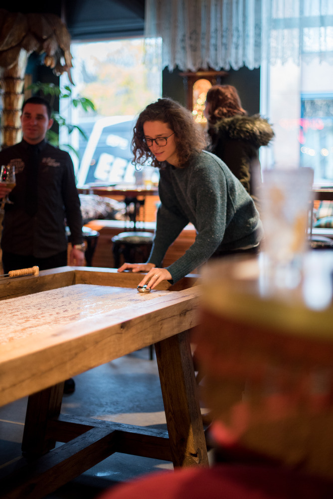 Playing shuffleboard at a cruise