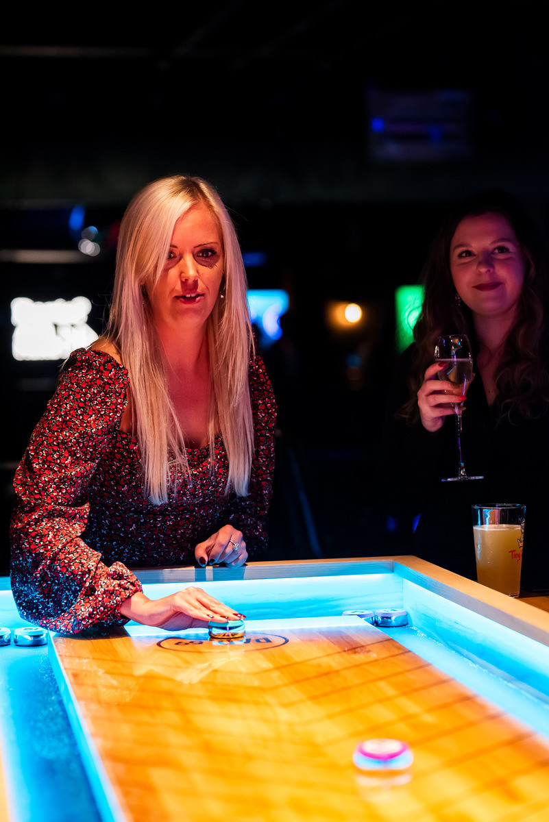 Shuffleboard game for bowling alleys